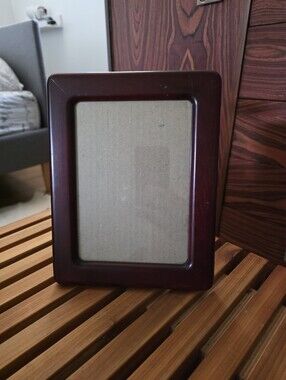 Lovely curved flat wooden tabletop picture frame. Mid-century purple tones.